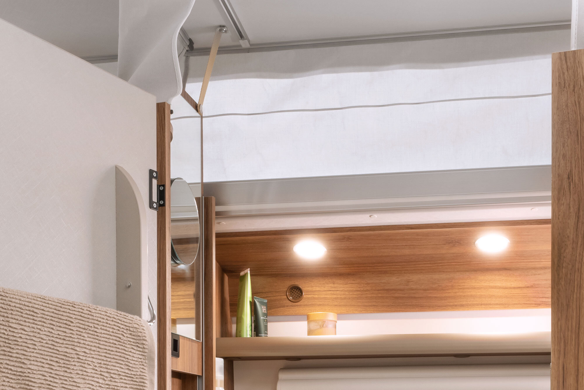The height-adjustable mirror moves up and down with the pop-top roof. 