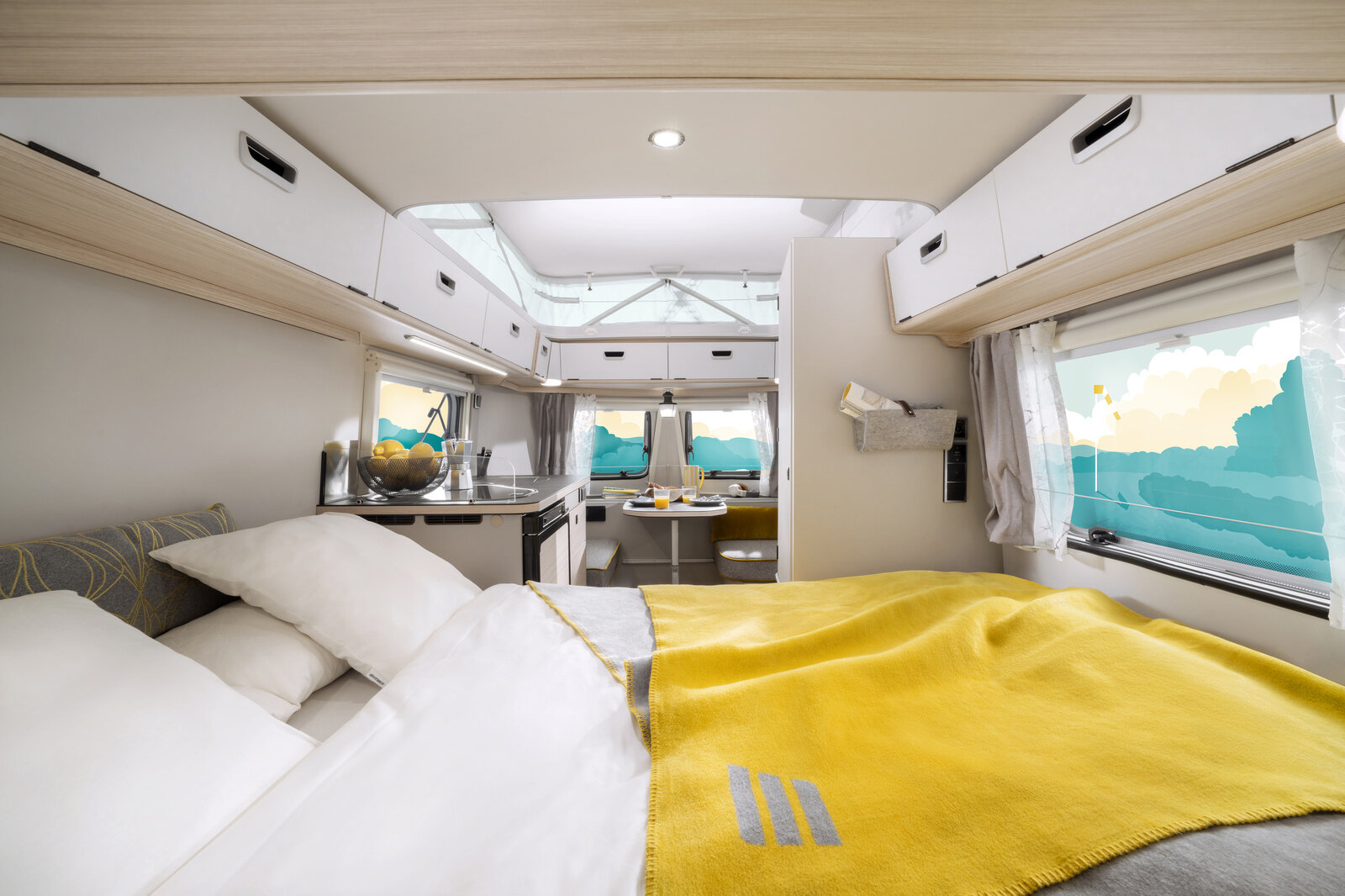 From the bed you have an open view of the cozy interior of your ERIBA Touring.